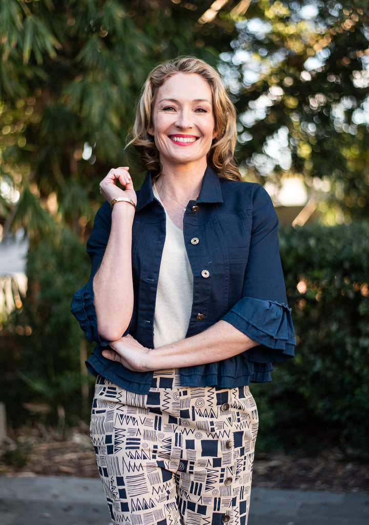 Lightweight cropped cotton jacket with stretch and soft frill detail. An easy layering piece to wear over dresses, denim or linen for everyday styling.