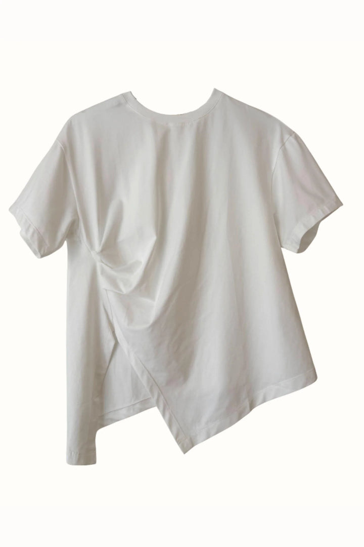 A white short-sleeve t-shirt with an asymmetrical draped hem, shown against a plain white background.
