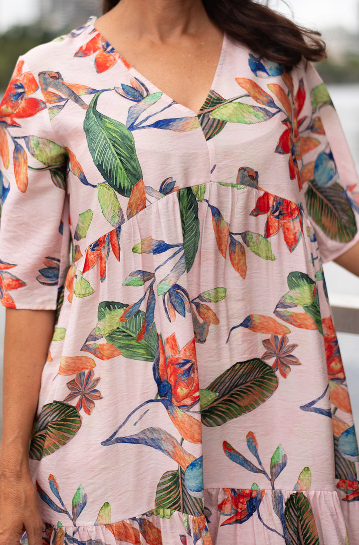 Colorful floral dress with a white background