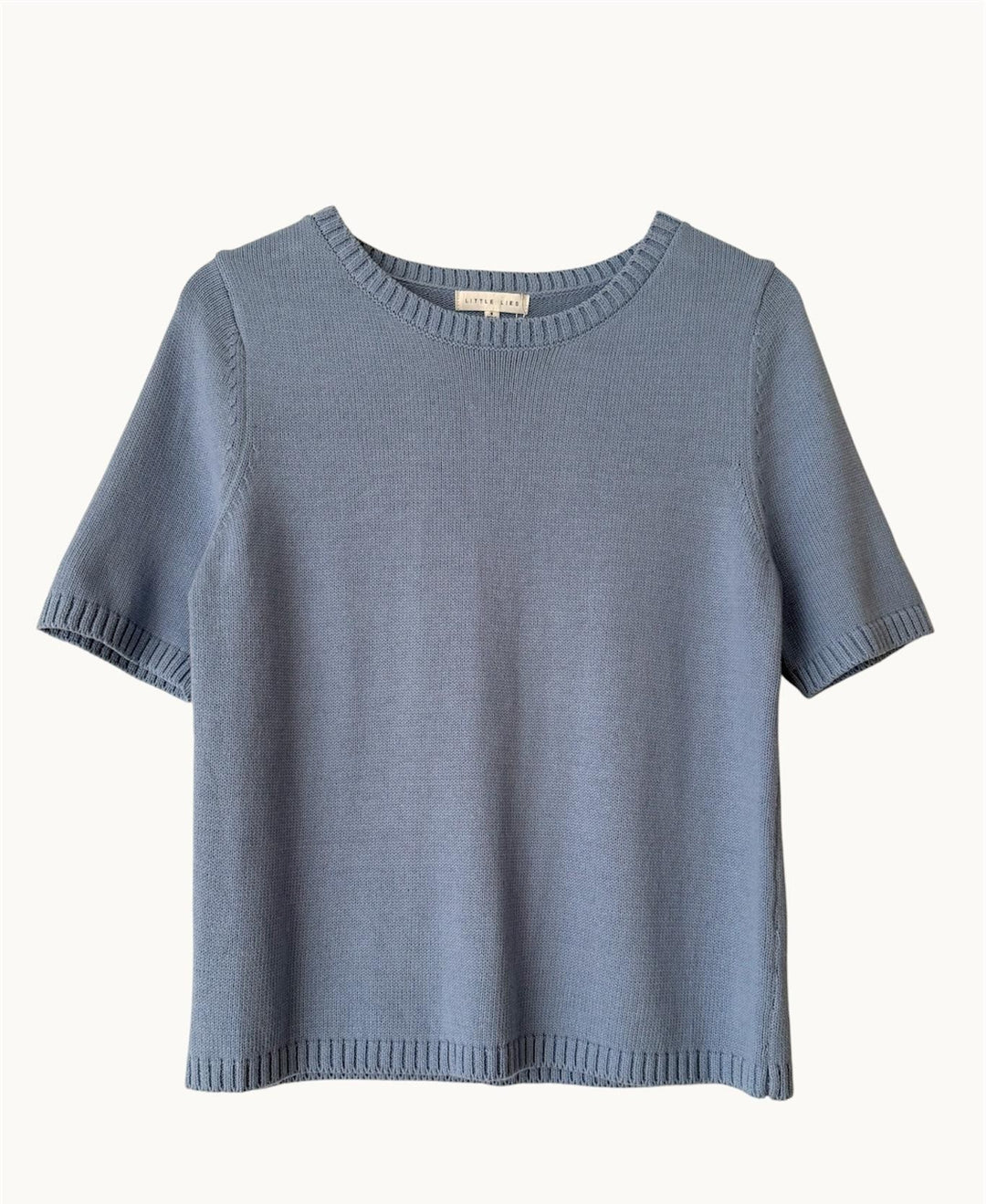 Blue sweater on a white background