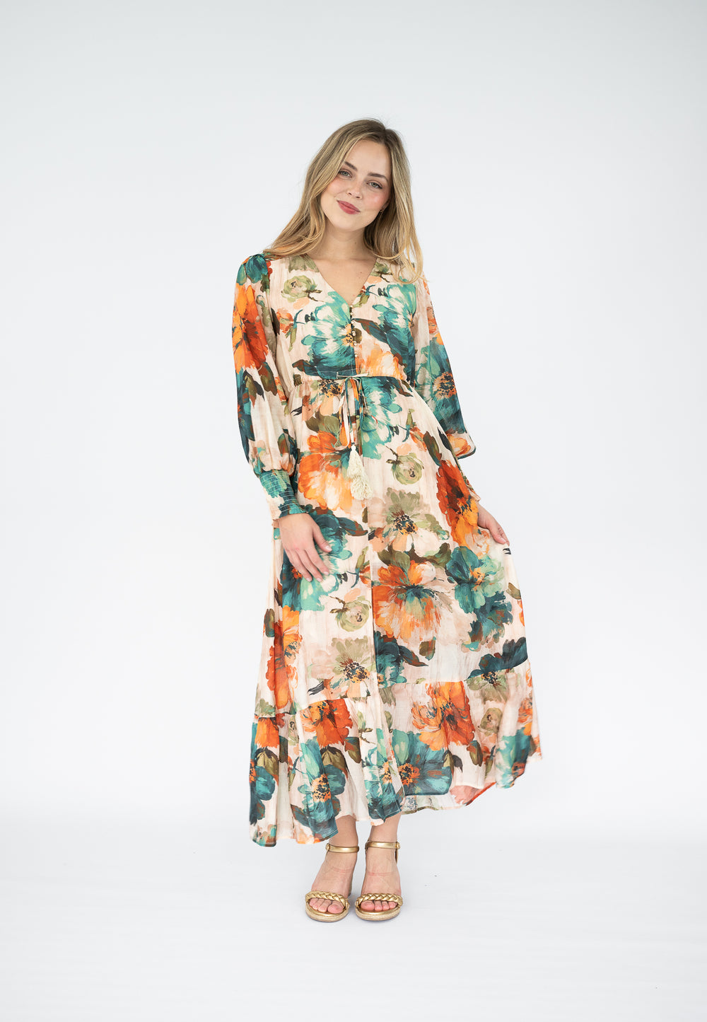 Woman wearing a floral dress on a white background