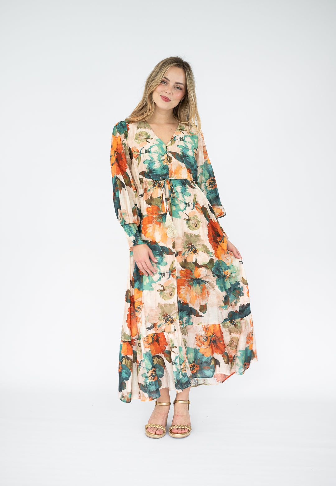 Woman wearing a floral dress on a white background