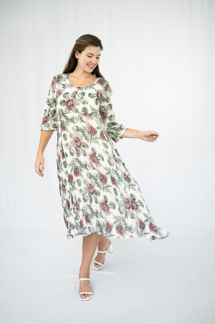 Woman wearing a floral dress on a white background