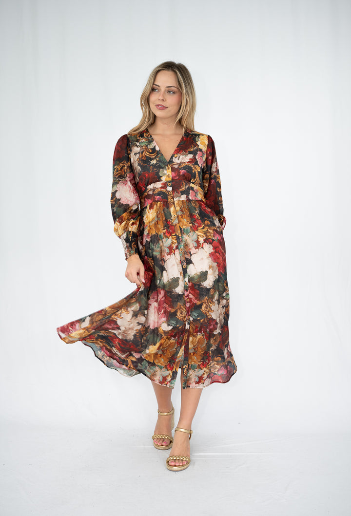 Woman wearing a floral dress on a white background