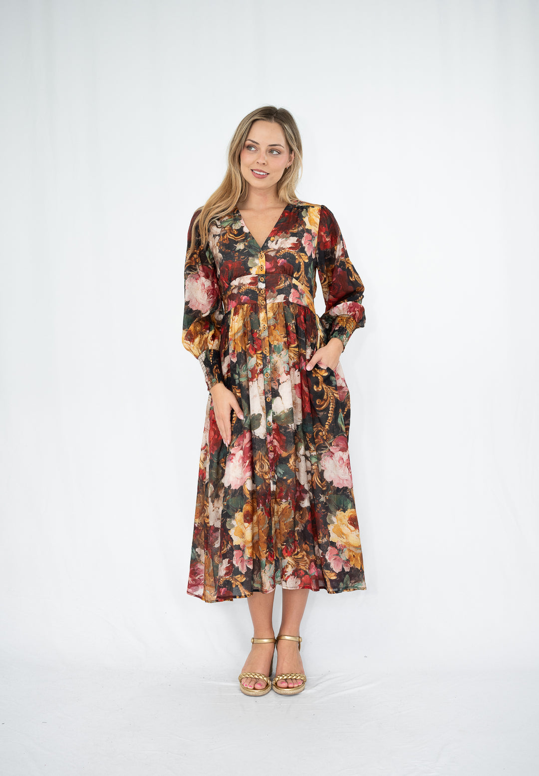 Woman wearing a floral dress on a white background