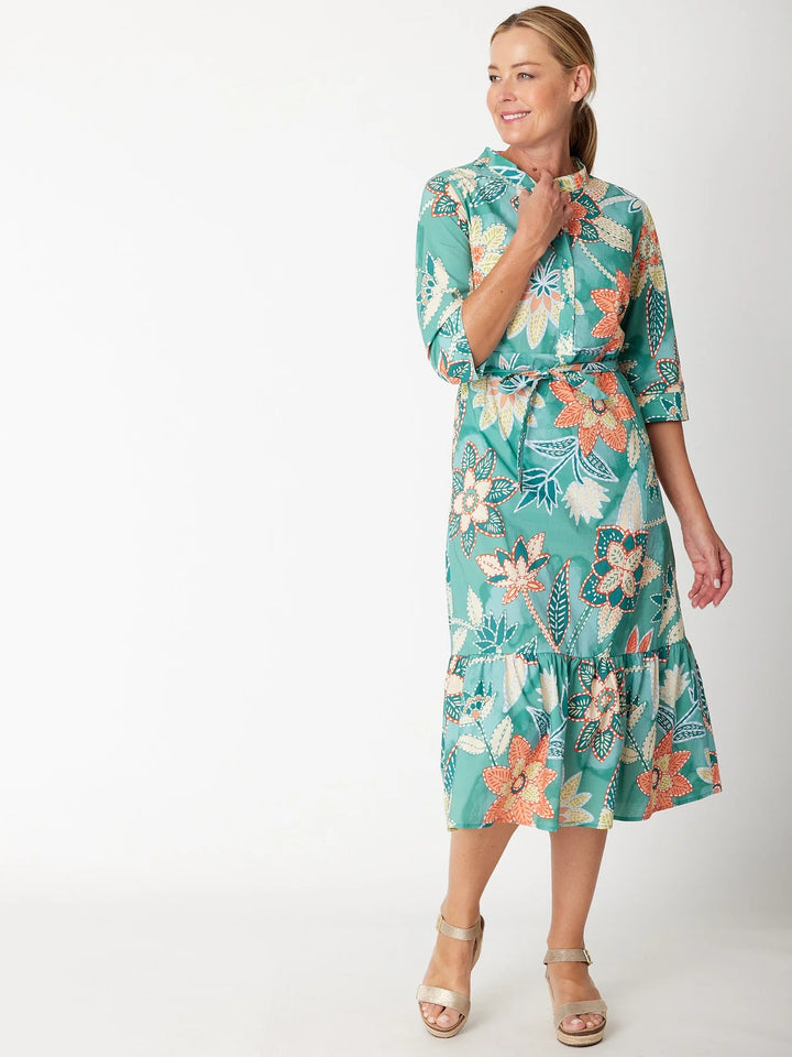 Woman wearing a floral dress on a white background